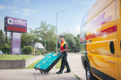 DHL delivery person delivers Van Gogh package. Photo: Ali Asher Photography.