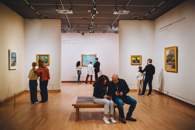 Visitors are viewing paintings from the permanent exhibition. Photo: Jelle Draper.
